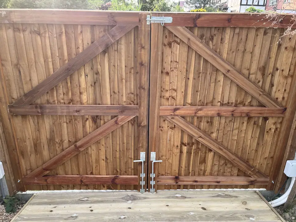 A pair of timber garden gates viewed from inside the garden
